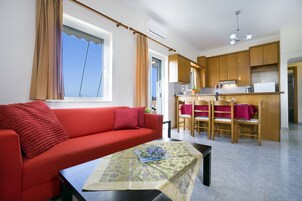 Deluxe Apartment, 2 Bedrooms | Living room | LCD TV, DVD player