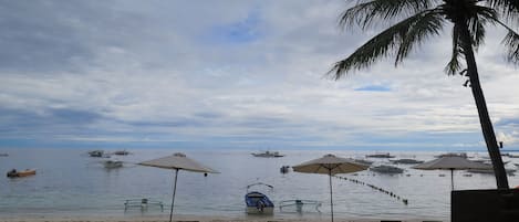 On the beach, sun-loungers, beach umbrellas, beach towels