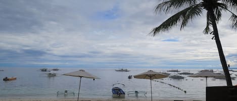 On the beach, sun loungers, beach umbrellas, beach towels