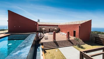 Outdoor pool, an infinity pool, sun loungers