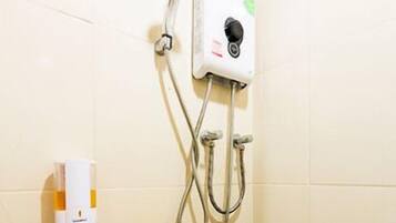 A shower with a handheld showerhead, a handheld soap dispenser, and a handheld towel dispenser.
