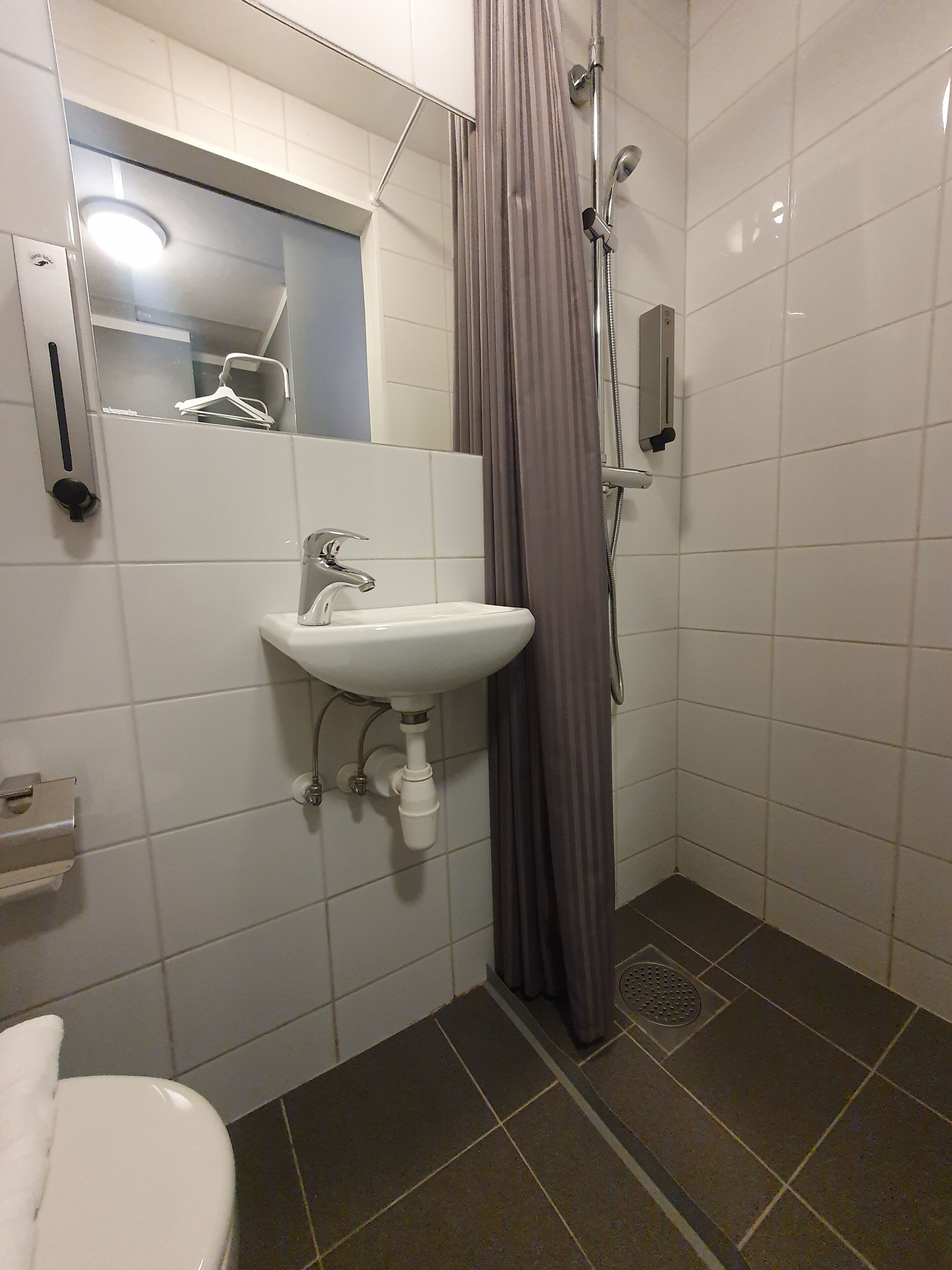 standard single room | bathroom | shower, hair dryer, towels, soap