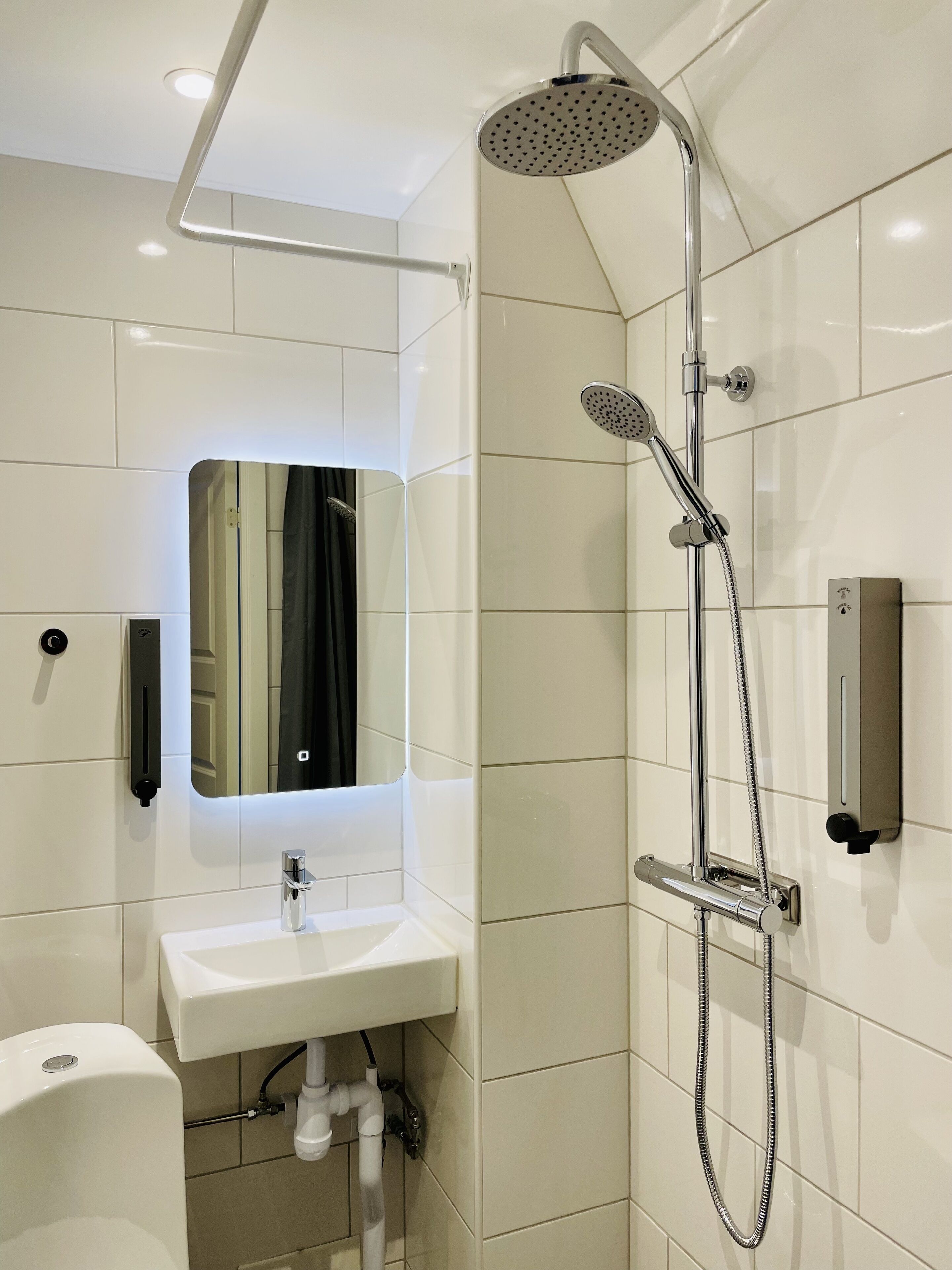 economy double room | bathroom | shower, hair dryer, towels, soap