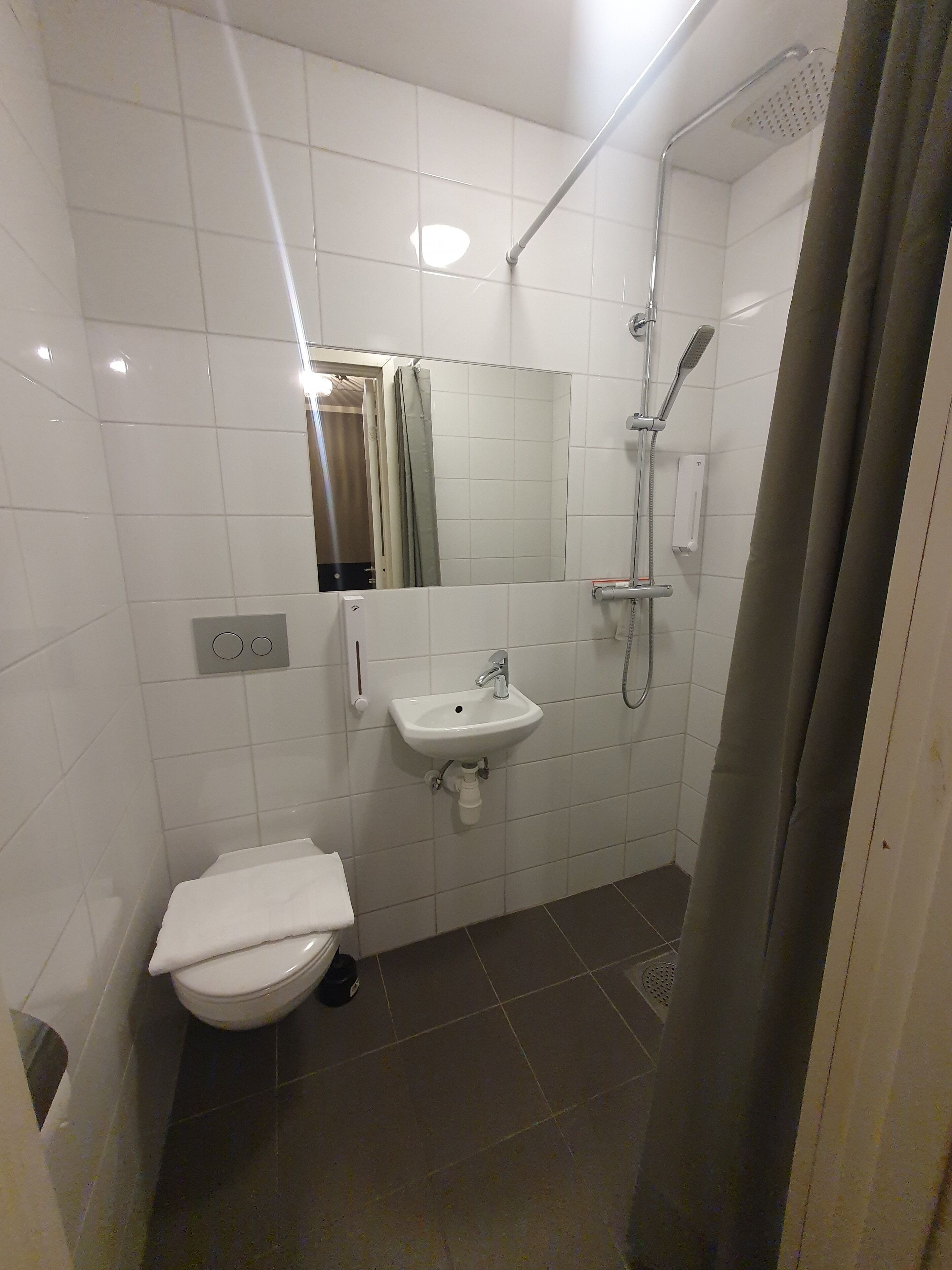 single room, no windows | bathroom | shower, hair dryer, towels, soap
