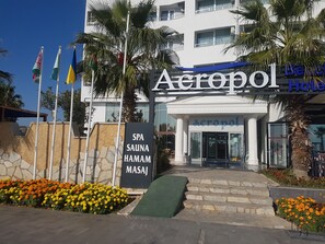 A hotel entrance with a sign for 'Acropol Hotel' and 'SPA SAUNA HAMAM MASAJ'. - Acropol Beach Hotel (Konyaalti)