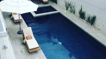 Outdoor pool, pool umbrellas, sun loungers