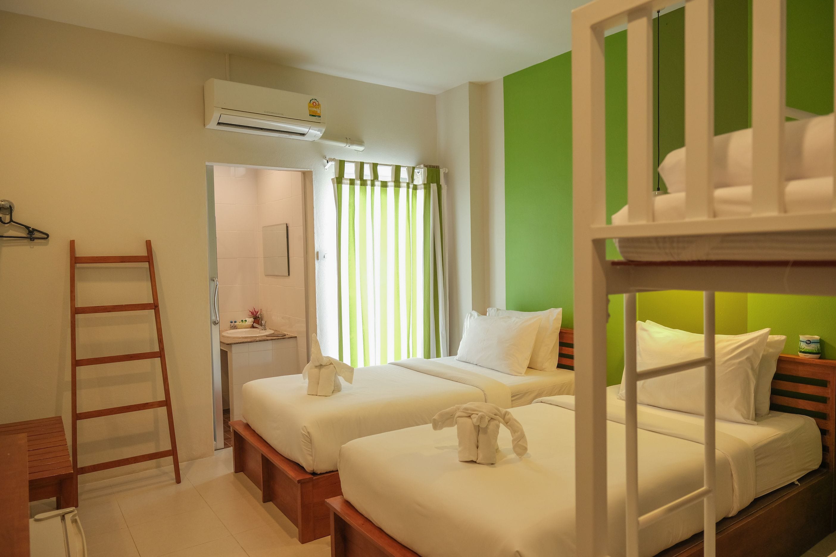 basic quadruple room, multiple beds, refrigerator | in-room safe, desk, free wifi