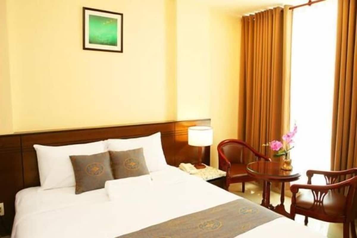 Premium bedding, desk, laptop workspace, soundproofing