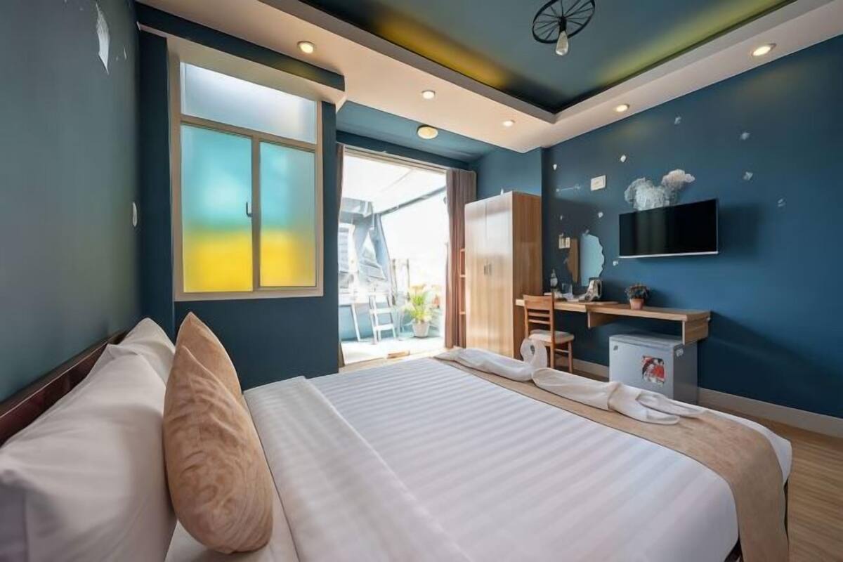 Premium bedding, desk, laptop workspace, soundproofing