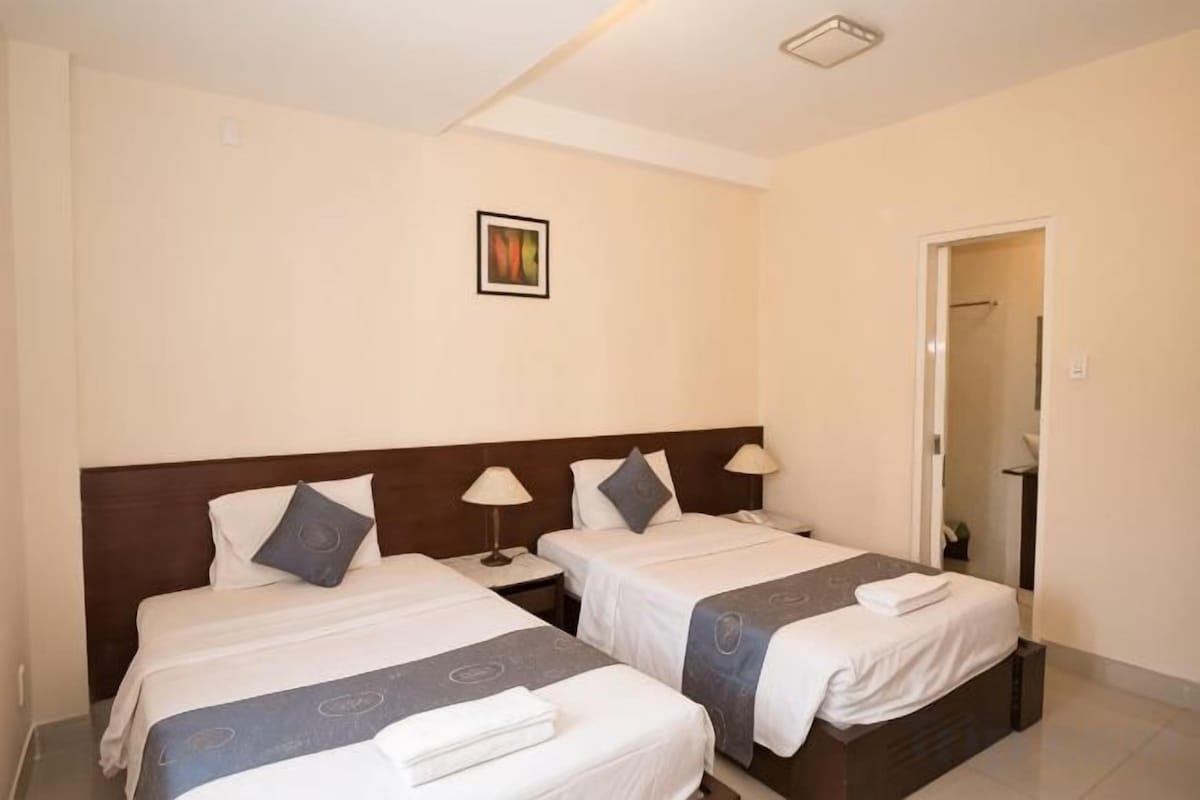 Premium bedding, desk, laptop workspace, soundproofing