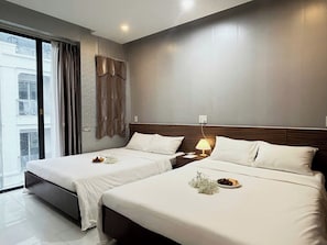 Family Room | Desk, blackout curtains, soundproofing, free WiFi - BeSea Hotel Da Nang (Da Nang)