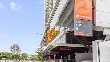 A modern building with a sign for TransLink and a sign for Milton station.