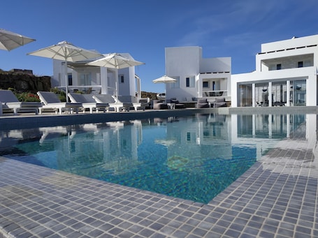 Seasonal outdoor pool, open 9:00 AM to 7:30 PM, pool umbrellas