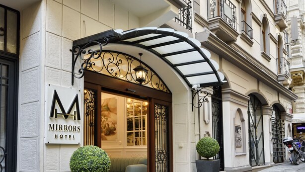 A hotel entrance with a sign reading "Mirrors Hotel". - Mirrors Hotel Istanbul Taksim City Center (Istanbul)