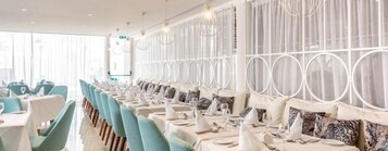 Breakfast, lunch served; international cuisine, pool views