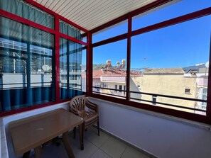 Family Room Loft (3 single beds or 1 double bed and 1 single bed) | Balcony view