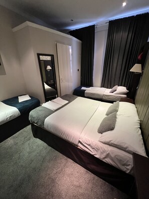 Executive Quadruple Room | Iron/ironing board, free WiFi - Goodwood Hotel (London)