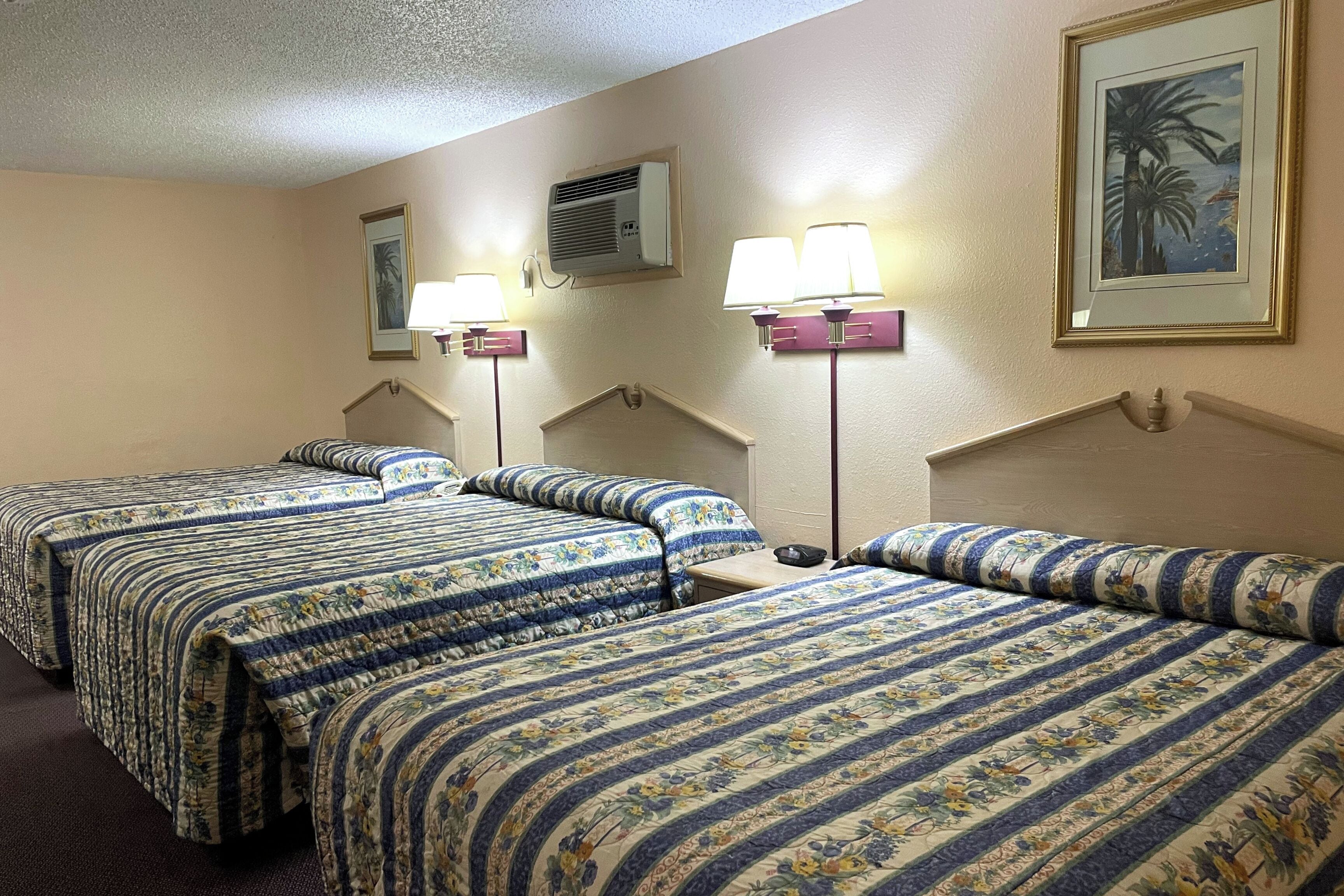 Deluxe Suite, Non Smoking (3 Queen Beds) | Premium bedding, desk, iron/ironing board, free WiFi