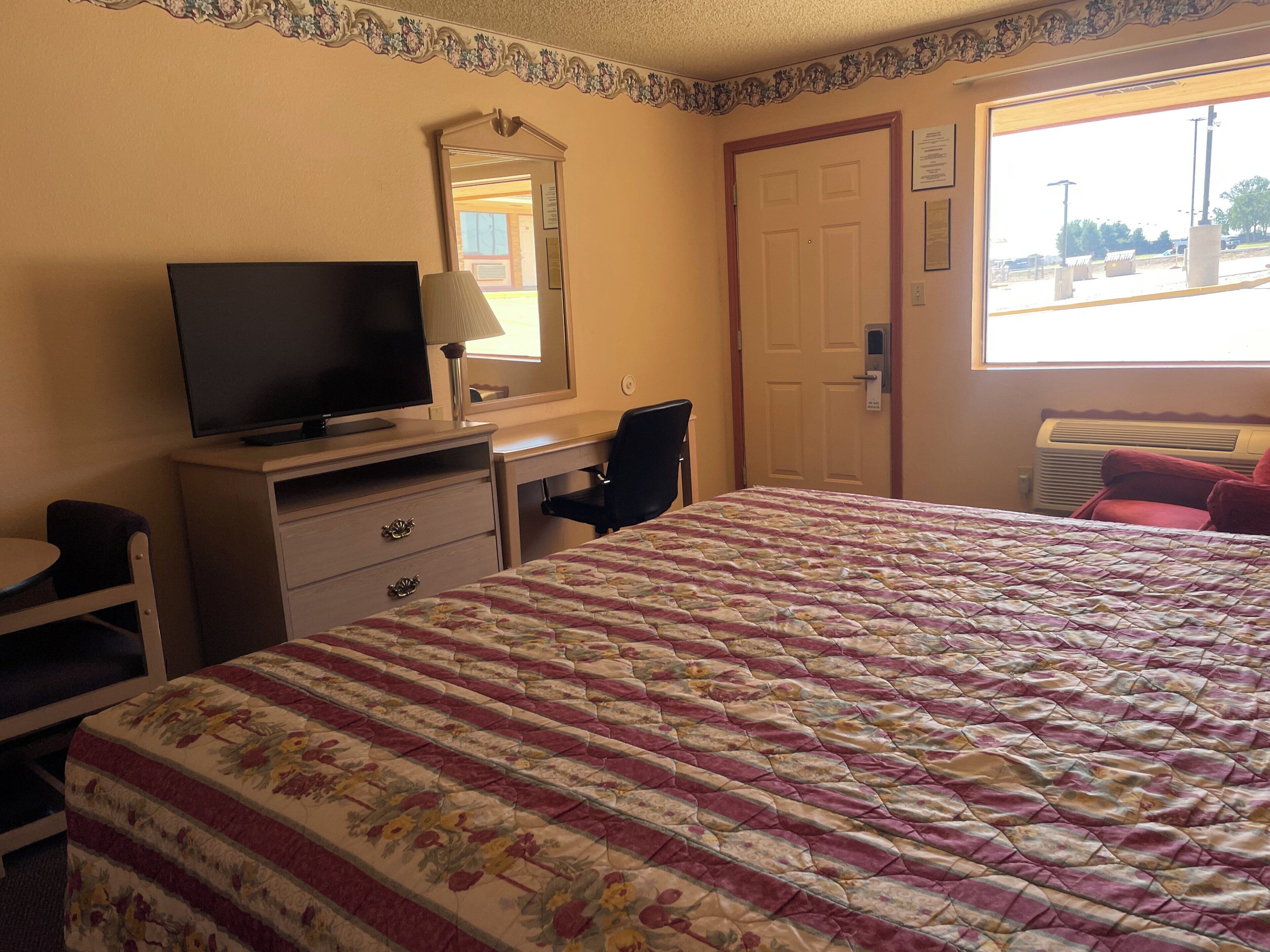 Room, 1 King Bed, Smoking | Premium bedding, desk, iron/ironing board, free WiFi