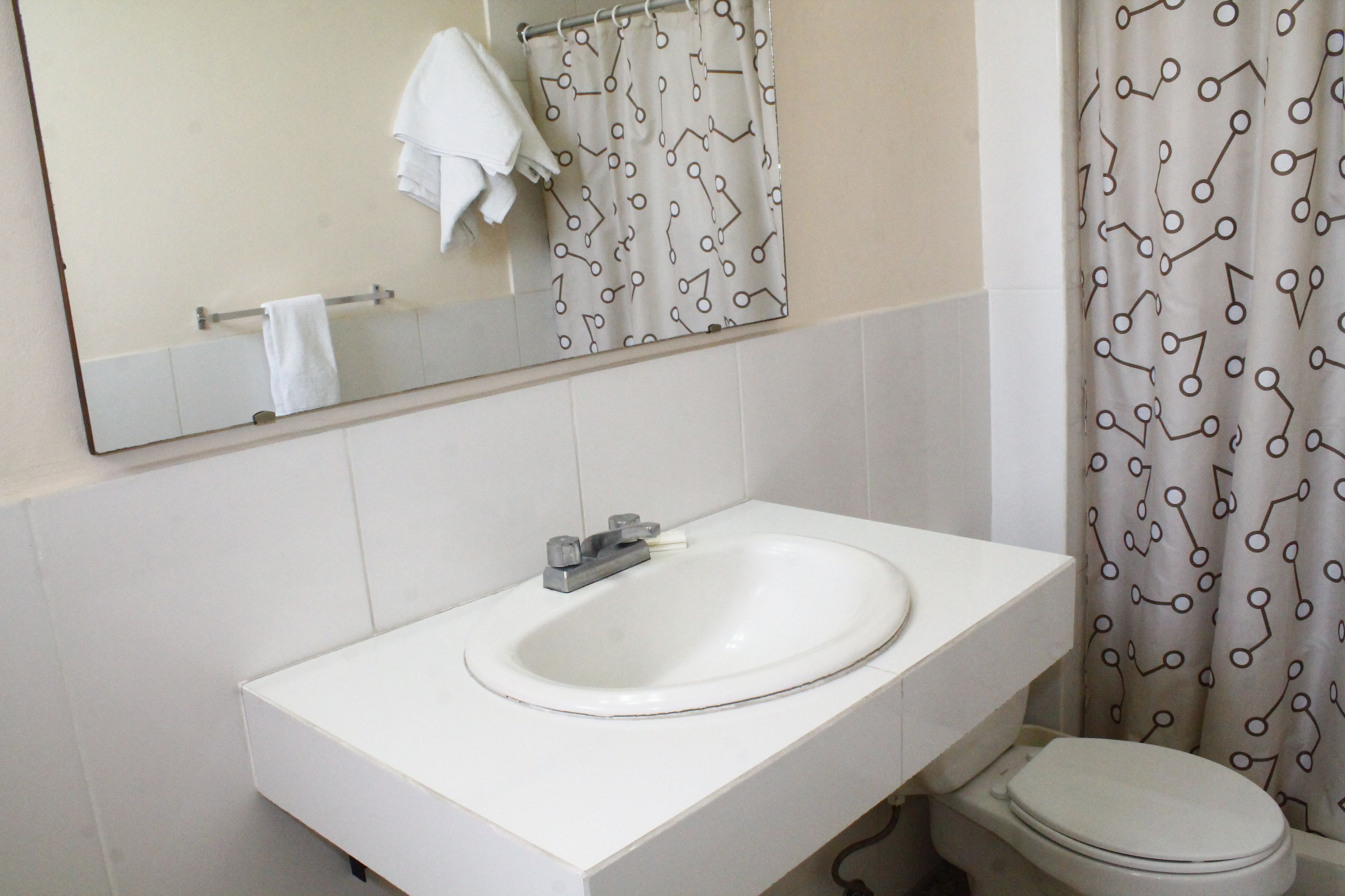 comfort single room, multiple beds | bathroom | shower, towels