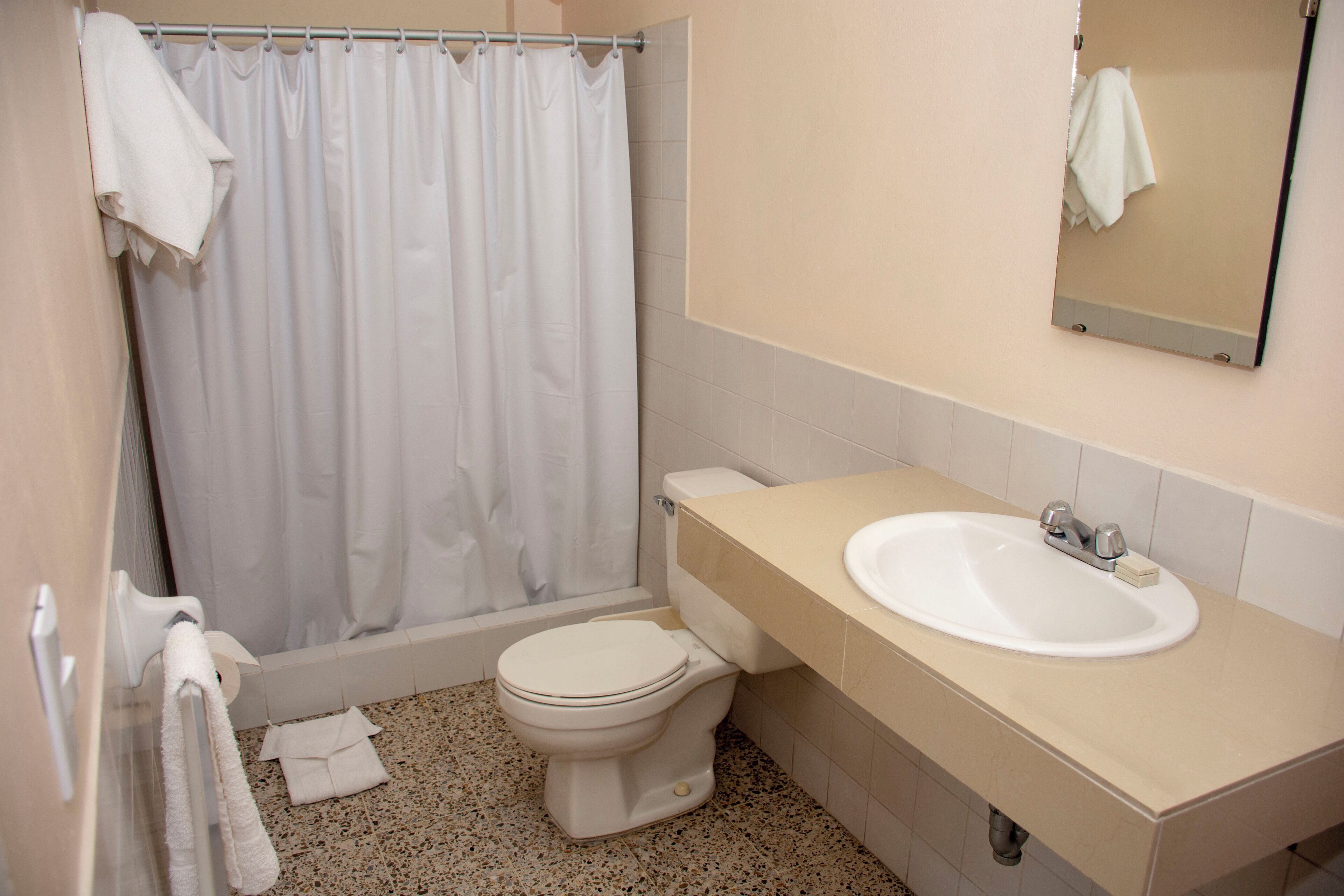standard double room, multiple beds | bathroom | shower, towels