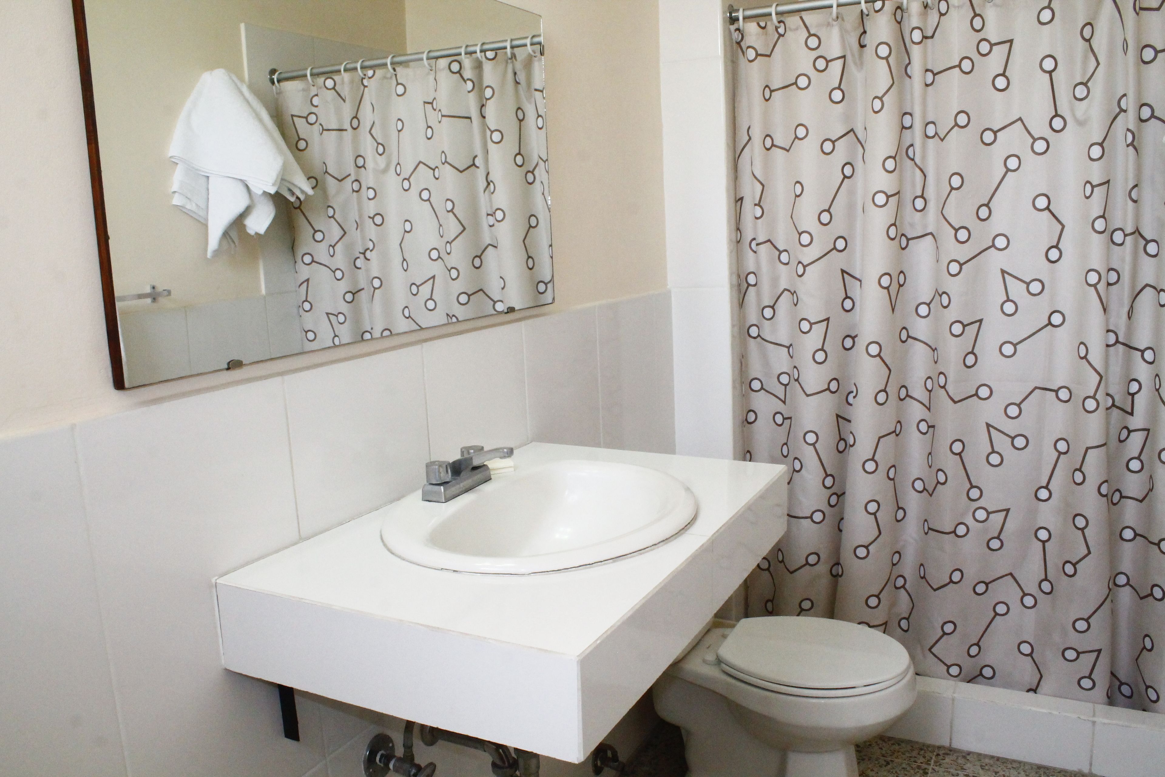 standard double room, multiple beds | bathroom | shower, towels