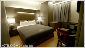 Habitación triple Deluxe | Ropa de cama de alta calidad, edredón y camas con efecto memoria