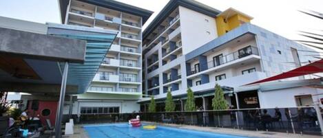 Outdoor pool, open 6:00 AM to 9:00 PM, free cabanas, pool umbrellas