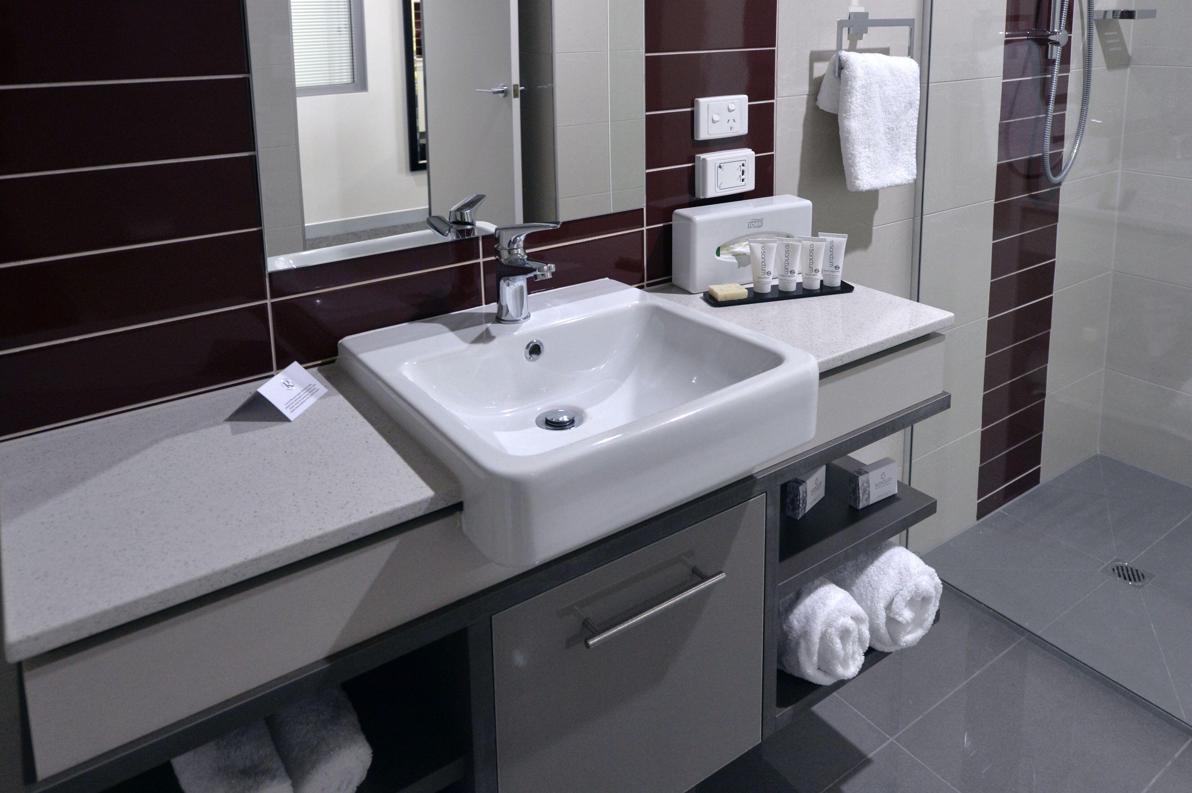 shower, designer toiletries, hair dryer, towels