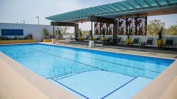 Outdoor pool, open 6:00 AM to 9:00 PM, free pool cabanas, pool umbrellas