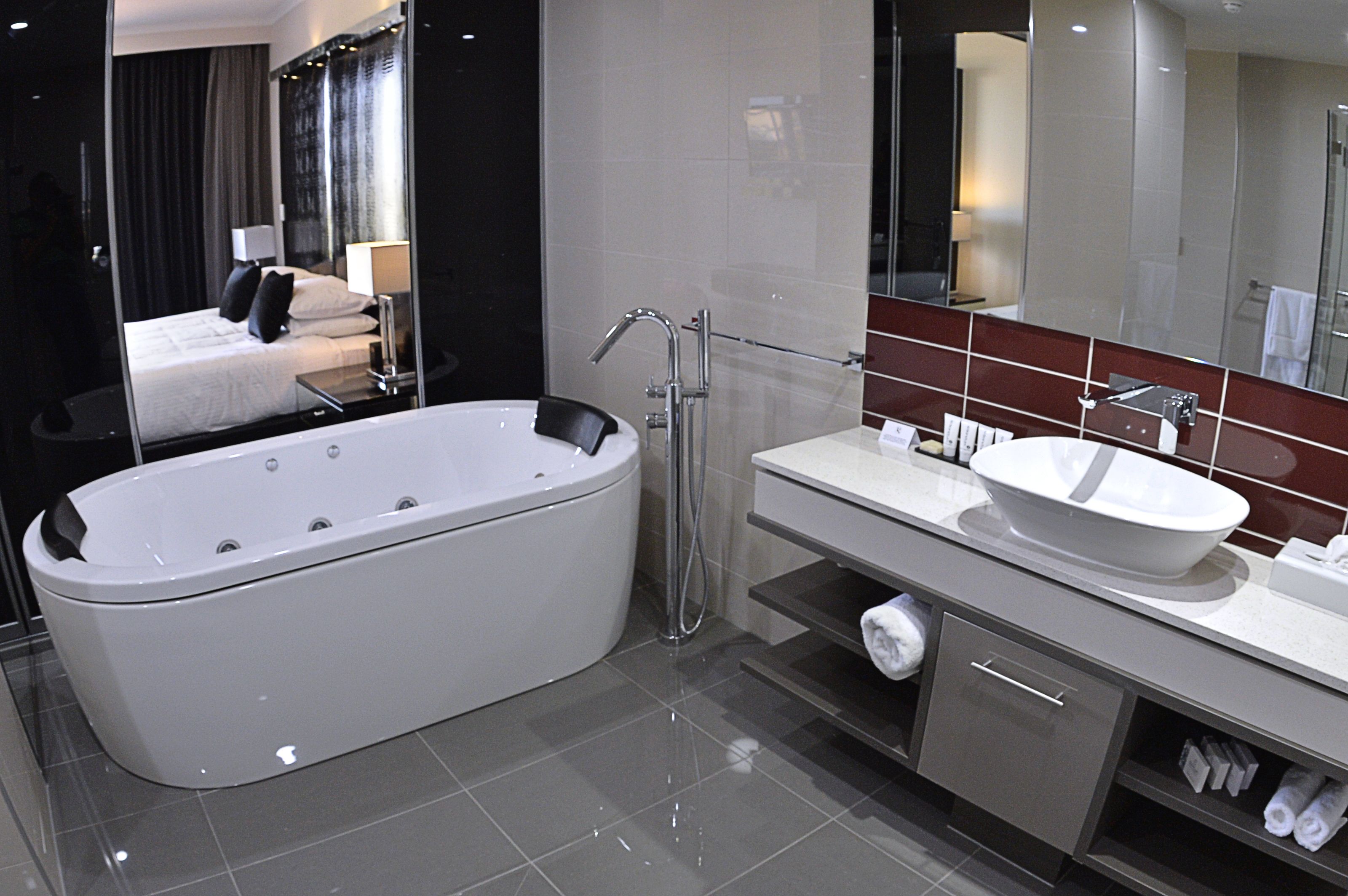 executive business suite with balcony | bathroom | shower, designer toiletries, hair dryer, towels