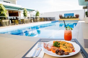 Outdoor pool, open 6:00 AM to 9:00 PM, free cabanas, pool umbrellas