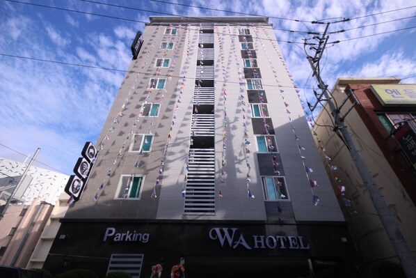 Experience the urban lifestyle at WA HOTEL, where modern architecture meets convenience with on-site parking.