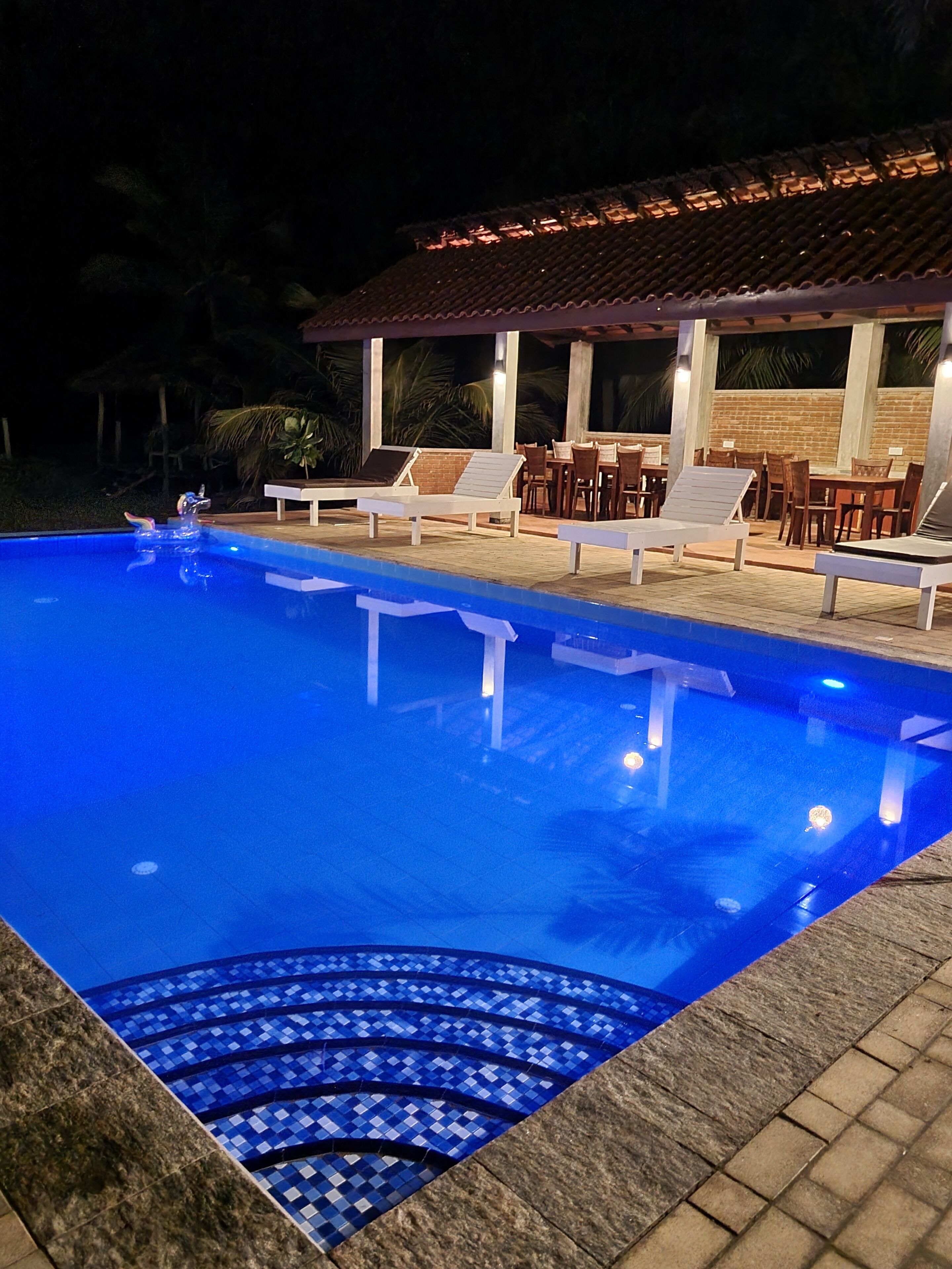 outdoor pool, an infinity pool, pool loungers