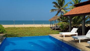 Outdoor pool, an infinity pool, sun loungers