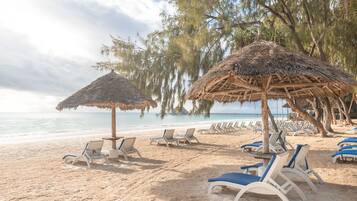 Private beach, white sand, sun loungers, beach umbrellas