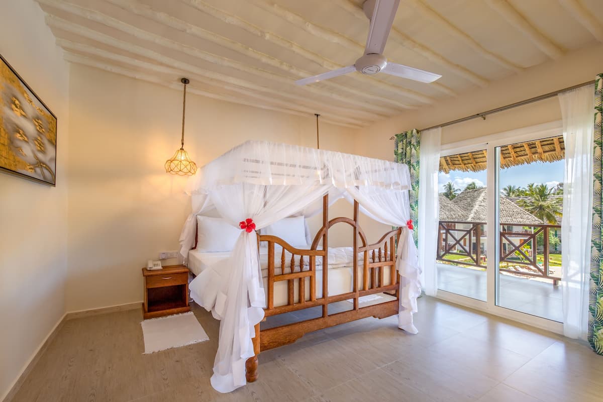 Family Room | 1 bedroom, premium bedding, free minibar items, in-room safe