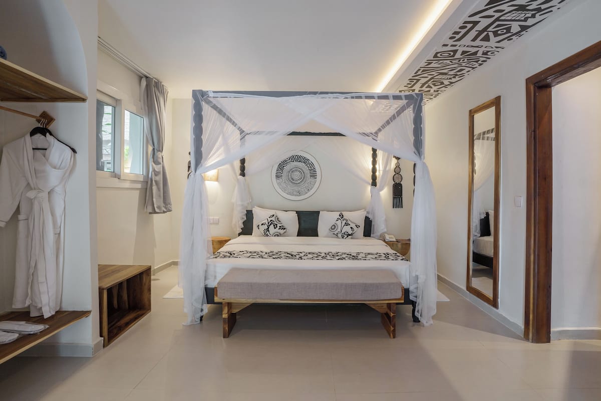 Signature kamer, 1 slaapkamer, niet-roken, uitzicht op tuin | 1 slaapkamer, luxe beddengoed, een minibar met enkele gratis items