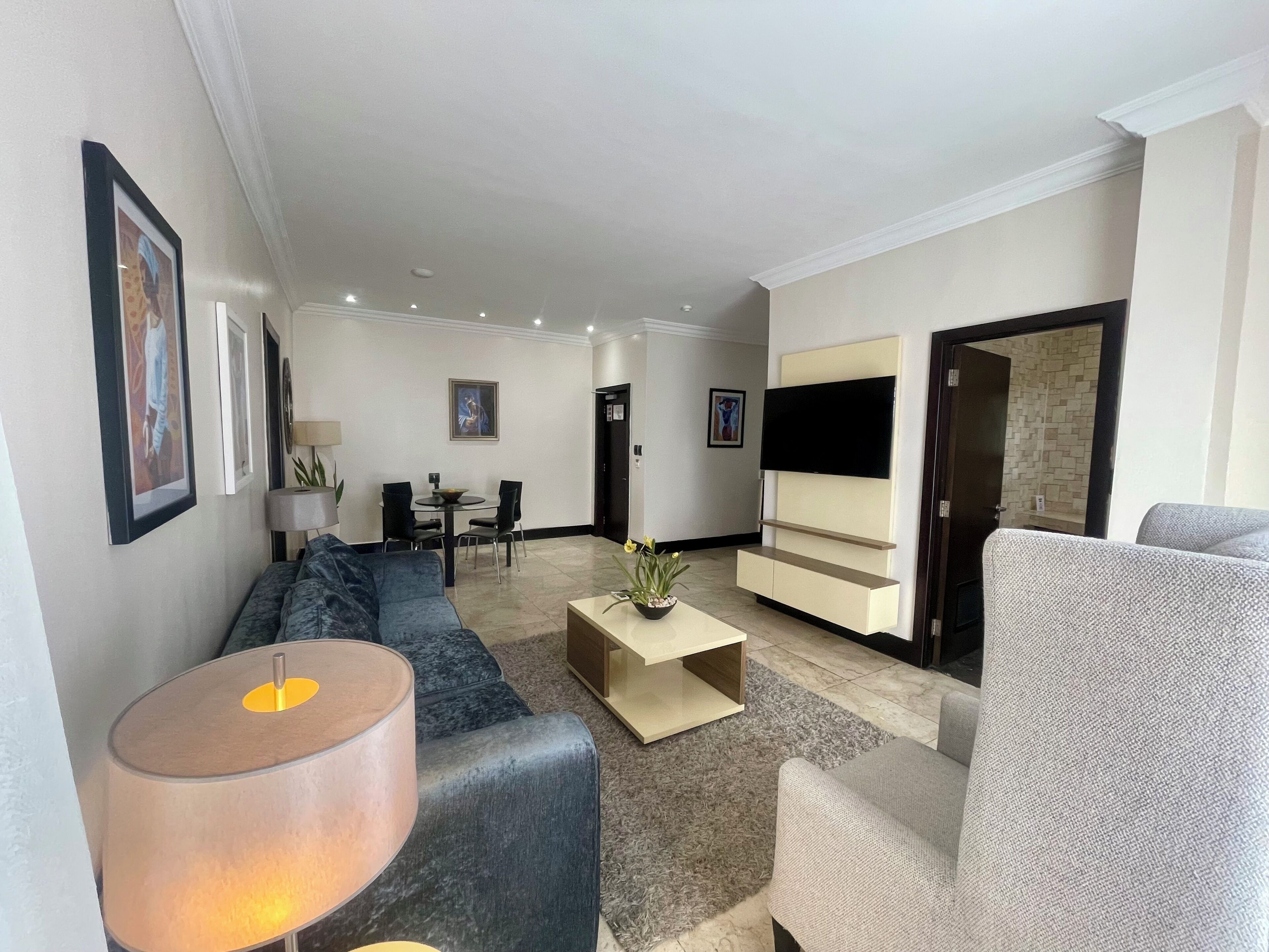 luxury suite, pool view | living room | 32-inch flat-screen tv with cable channels, tv