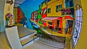 A colorful street scene with buildings and a canal. - Coasta Bangsaen (Chonburi)