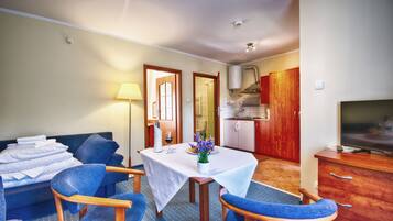 Family Bungalow, 1 Bedroom, Kitchenette (in a bungalow) | Living area | Flat-screen TV, table football, toys, books