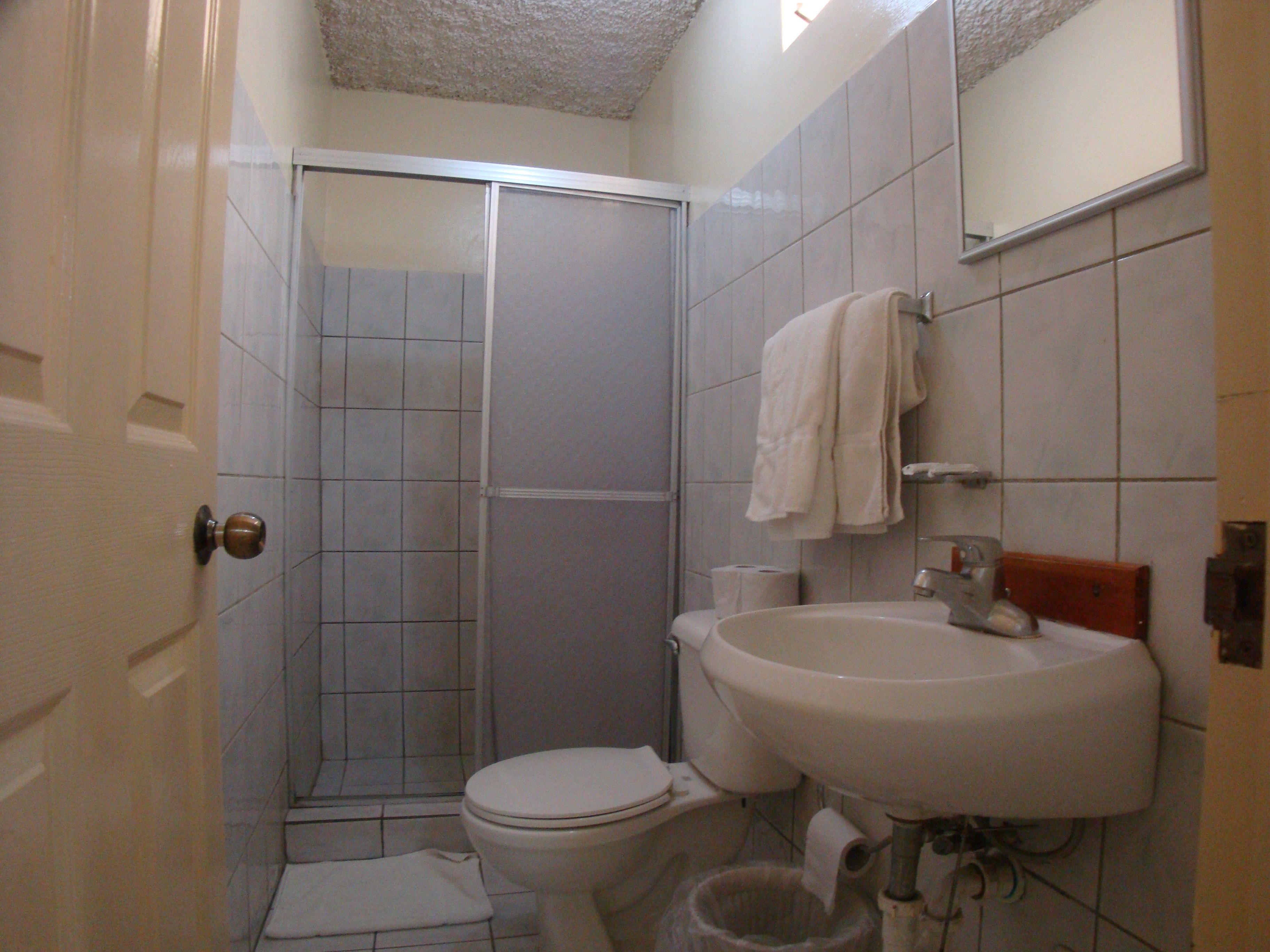 standard quadruple room, 2 double beds, private bathroom, annex building | bathroom | free toiletries, towels, soap, shampoo
