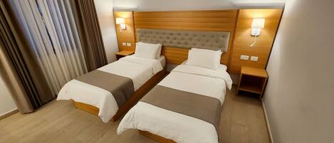 Comfort Twin Room | Hypo-allergenic bedding, in-room safe, desk, laptop workspace