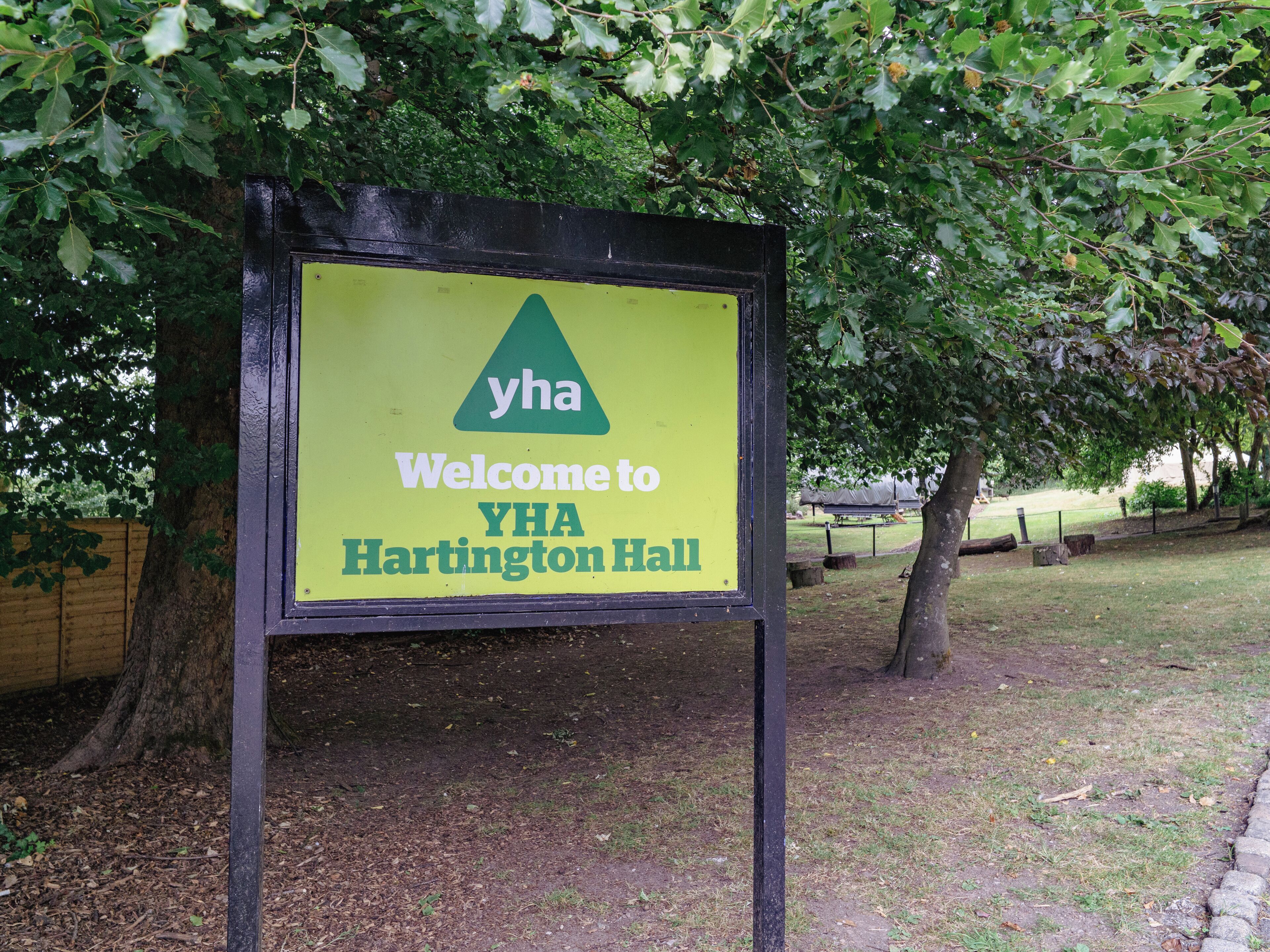 A sign welcoming visitors to YHA Hartington Hall.