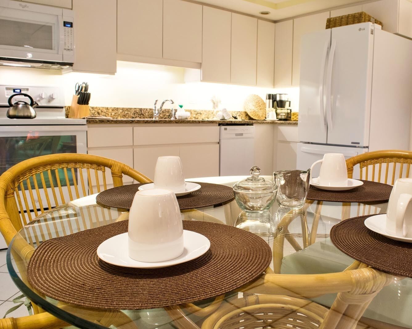 A modern kitchen with a dining area.