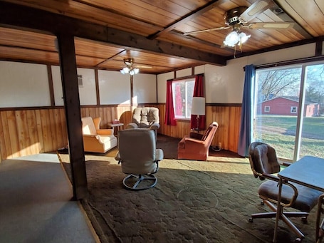 The House at 503 (Not Pet Friendly) | Living room | 32-inch flat-screen TV with cable channels, TV, books