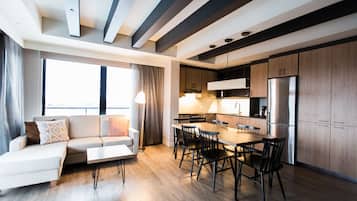 Chambre Signature, 1 trÚs grand lit et 1 canapé-lit | Cuisine privée