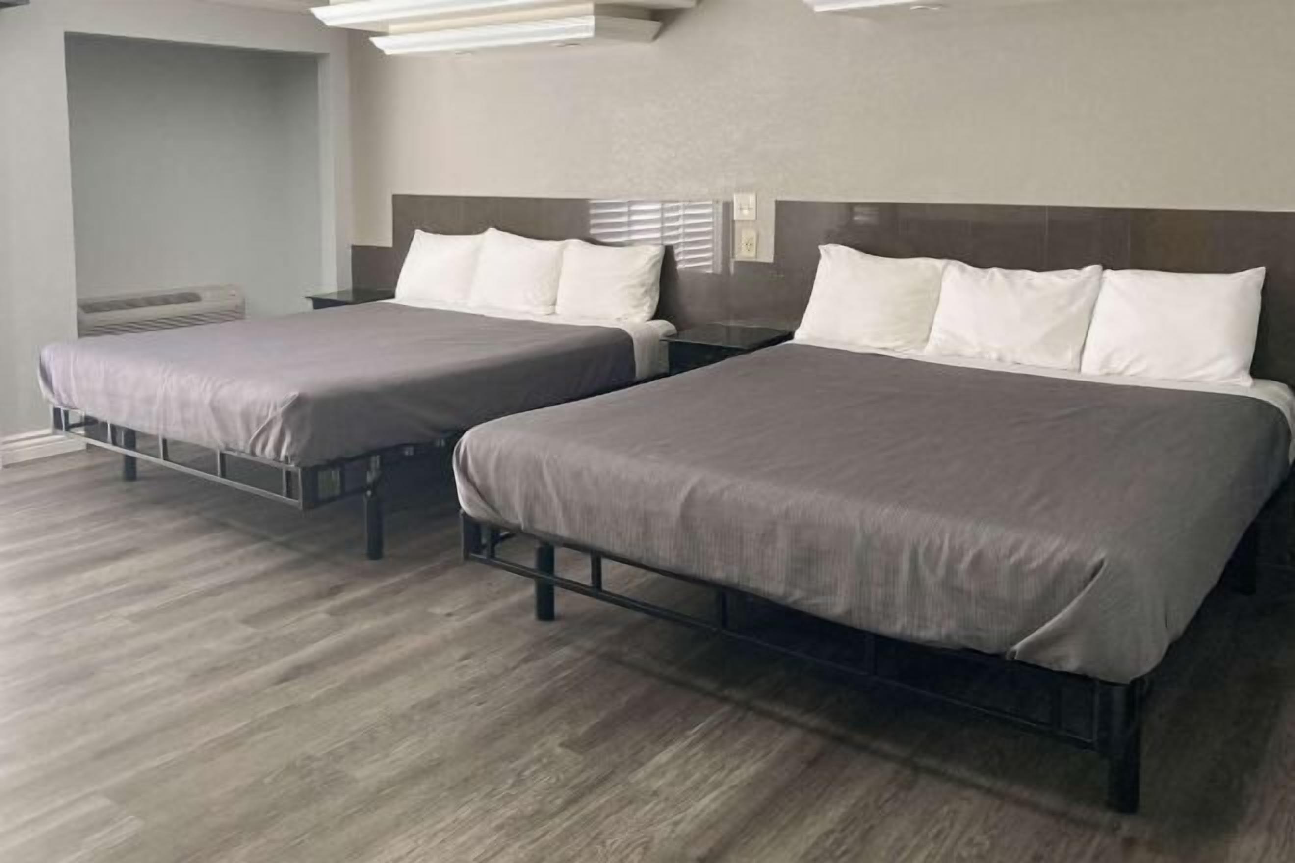 Desk, laptop workspace, blackout drapes, iron/ironing board