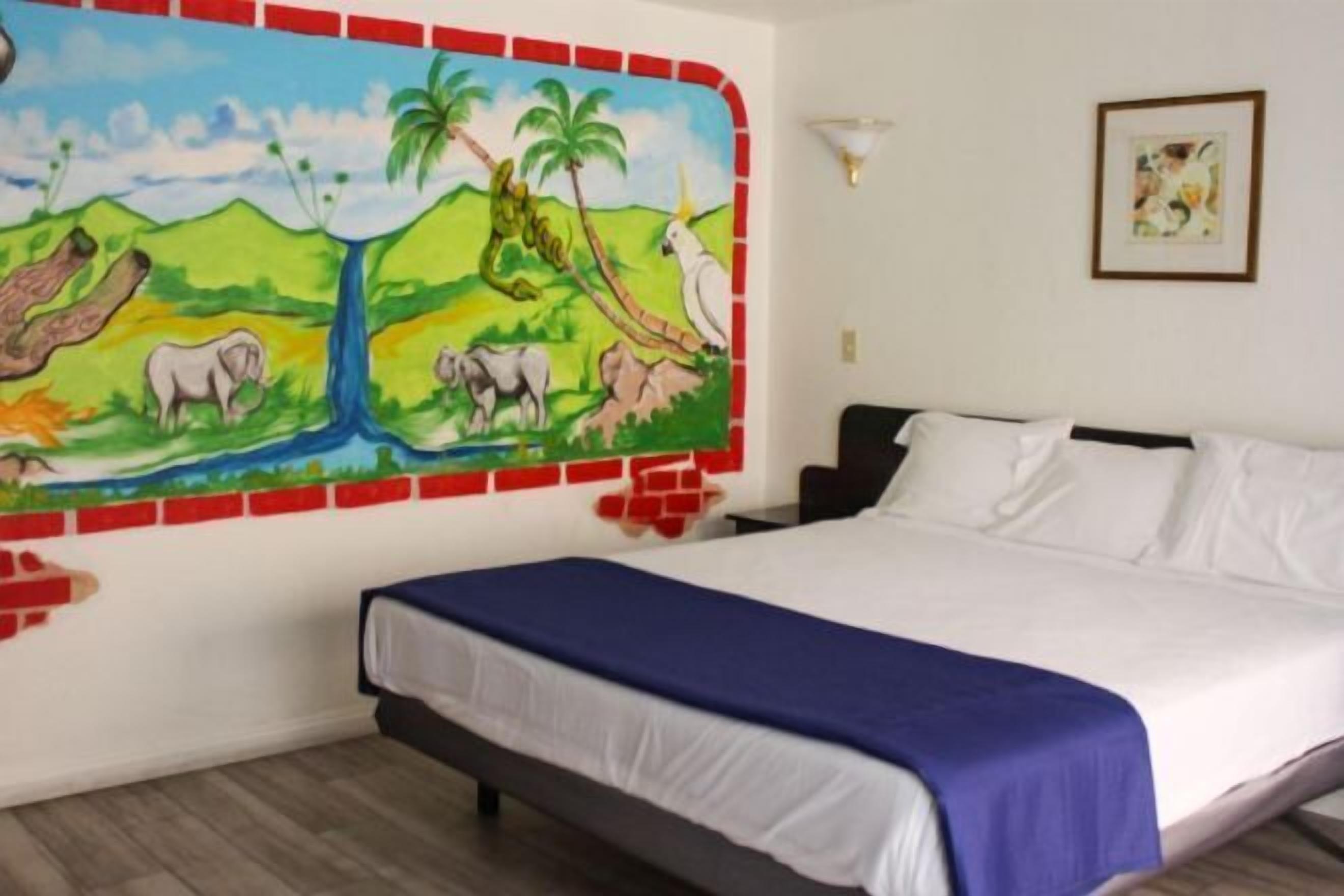 Desk, laptop workspace, blackout drapes, iron/ironing board