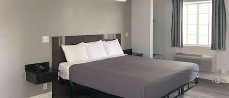 Desk, laptop workspace, blackout curtains, iron/ironing board